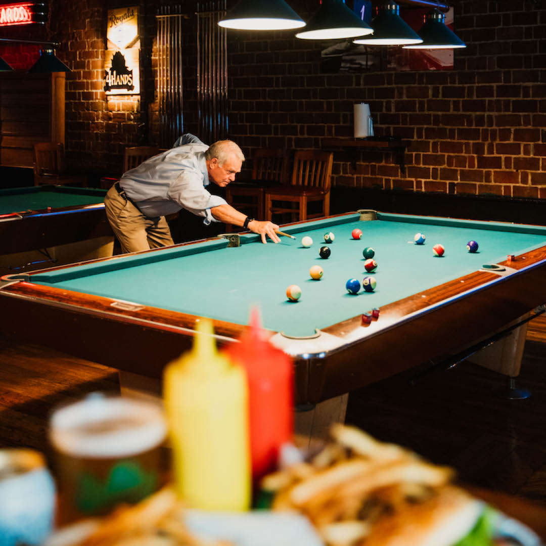 Enjoy a game of pool with friends, sip on Missouri craft beers, and dig into the Famous Billiards Burger.